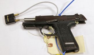 A Ruger pistol, that was shown during the Dzhokhar Tsarnaev federal death penalty trial, is displayed at a conference room at the John Joseph Moakley United States Courthouse in Boston, Tuesday, March 17, 2015.  Stephen Silva said during testimony Tuesday that he loaned Tsarnaev a P95 Ruger pistol in February 2013. Authorities say the P-95 Ruger was the gun used to kill MIT police officer Sean Collier.  (AP Photo/Charles Krupa)