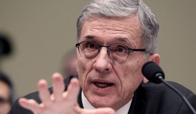 Federal Communications Commission Chairman Tom Wheeler testifies before the House Oversight and Government Reform Committee hearing on net neutrality. (AP Photo/Lauren Victoria Burke) ** FILE **