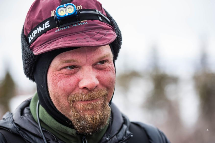 Aaron Burmeister looks on at the Koyuk, Alaska, checkpoint during the Iditarod Trail Sled Dog Race, Monday, March 16, 2015. (AP Photo/Alaska Dispatch News, Loren Holmes )