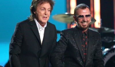 In this Jan. 26, 2014, file photo, Paul McCartney, left, and Ringo Starr appear at the 56th annual Grammy Awards in Los Angeles. McCartney will induct his former Beatle mate, Ringo Starr, into the Rock and Roll Hall of Fame next month. The 30th annual induction ceremony is scheduled for Cleveland&#39;s Public Hall on April 18. (Photo by Matt Sayles/Invision/AP, File)