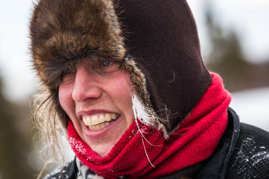 Despite a long, slow run that didn't leaver her in the position she was hoping, Aliy Zirkle was in good spirits at the Koyuk, Alaska, checkpoint during the Iditarod Trail Sled Dog Race, Monday, March 16, 2015. (AP Photo/Alaska Dispatch News, Loren Holmes)