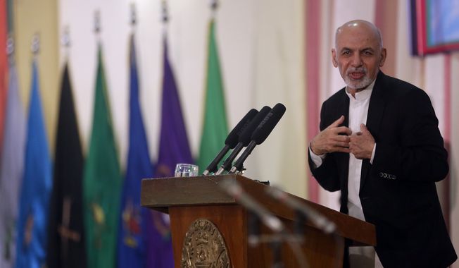 Afghan President Ashraf Ghani speaks during a graduation ceremony inspects guards of honor at a military academy, in Kabul, Afghanistan, Wednesday, March 18, 2015. (AP Photo/Massoud Hossaini)