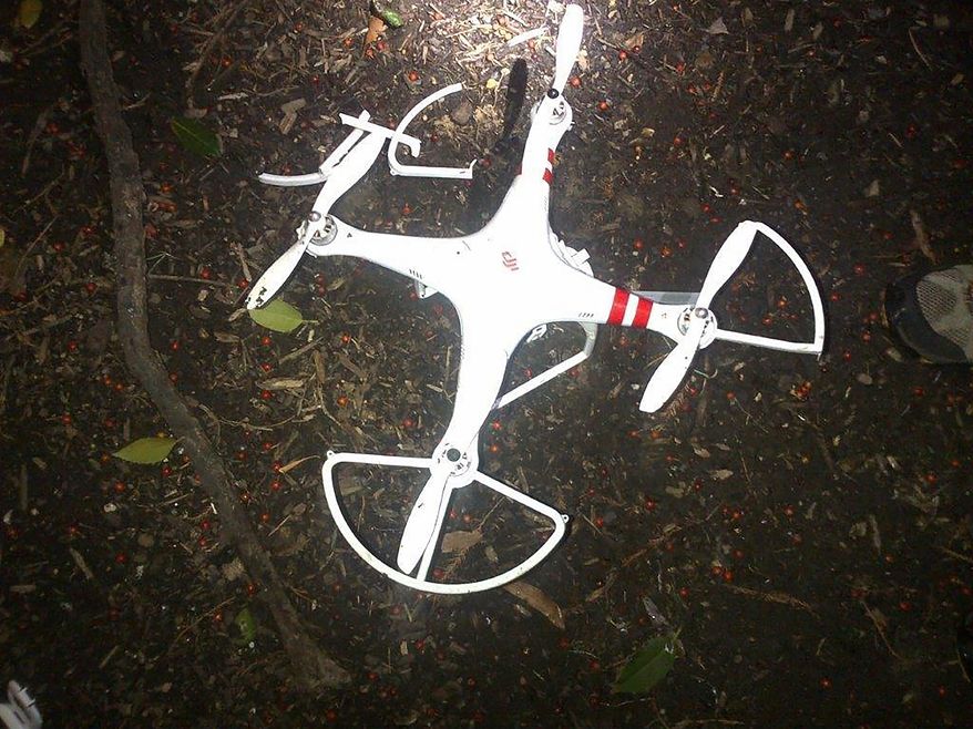 This handout photo provided by the US Secret Service shows the drone that crashed onto the White House grounds in Washington, Monday, Jan. 26, 2015. An intelligence agency employee whose drone crashed on the White House lawn earlier this year won&#x27;t face criminal charges, the U.S. Attorney&amp;#8217;s Office in Washington announced Wednesday. Shawn Usman, who works for the National Geospatial-Intelligence Agency, was piloting the borrowed drone in downtown Washington early on Jan. 26 when he lost control of it. Prosecutors said Usman, who had borrowed the drone from a friend, tried to regain control of the aircraft while it was flying westward and climbed to about 100 feet at about 3 a.m. (AP Photo/US Secret Service)
