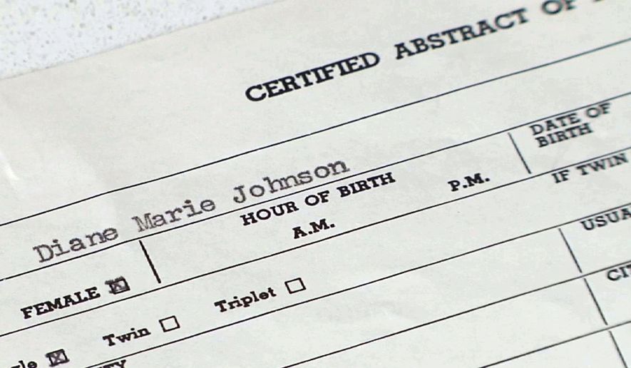 Off-the-books adoptions: This June 16, 2014, photo shows Diane Warner&#39;s birth certificate.  Diane Warner of Grand Rapids, Michigan, is one of the 200 newborns in the 1950s and 60s that were relocated in off-the-books adoptions through Dr. Thomas Hicks&#39; McCaysville clinic in far northern Georgia. (AP Photo/Alex Sanz)