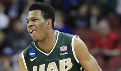 UAB forward William Lee smiles after scoring against Iowa State during the first half of an NCAA tournament second round college basketball game in Louisville, Ky., Thursday, March 19, 2015. (AP Photo/David Stephenson)