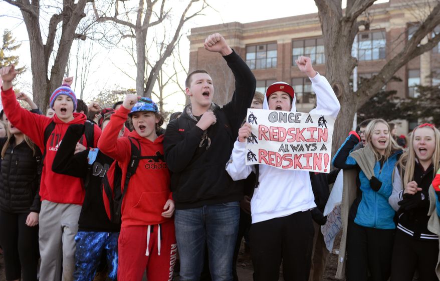Lancaster High School students rally in front of Lancaster Middle School to protest the district’s dropping of the school's nickname and mascot Thursday, March 19, 2015, in Lancaster, N.Y. The students in the western New York school district walked out of class in protest of a decision to retire the Redskins nickname because it offends some Native Americans. The school board voted this week to retire it altogether after three nearby districts with sizeable numbers of Native American students canceled lacrosse matches. (AP Photo/Gary Wiepert)
