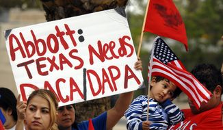 Over 100 hundred people demonstrated in front of the Federal Courthouse in Brownsville, Texas, Thursday, March 19, 2015. The Justice Department might face sanctions if a federal judge determines its attorneys misled him about whether part of President Barack Obama&#39;s executive action on immigration was implemented prior to it being put on hold by the judge. U.S. District Judge Andrew Hanen last month halted Obama&#39;s plan. The president&#39;s plan would spare from deportation up to 5 million people in the U.S. illegally. (AP Photo/Brownsville Herald, Brad Doherty)
