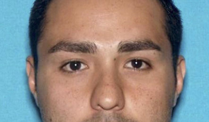 FILE - This undated file photo provided by the Pomona, Calif., Police Department shows Henry Solis. The rookie Los Angeles police officer charged with murder in the killing of a man during an off-duty fight fled with the help of his father to Texas where the men have family, according to a federal arrest warrant filed Thursday, March 19, 2015. The document says Solis called his father, Victor Solis of Lancaster, for help after a brawl outside a downtown Pomona bar early Friday in which Salome Rodriguez was shot multiple times and killed. (AP Photo/Pomona Police Department, File)