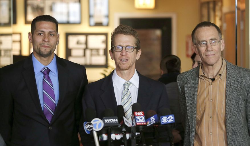 CORRECTS RIVERA'S LOCATION TO LEFT FROM RIGHT - Juan Rivera, left, who wrongfully served more than 19 years in prison for the 1992 rape and murder of an 11-year-old Waukegan girl, stands with attorneys Jon Loevy, center, and Locke Bowman, during a news conference Friday, March 20, 2015, in Chicago. Attorneys for Rivera said Friday they've settled a federal lawsuit against prosecutors and police for $20 million. Rivera was tried three times for the rape and murder of Holley Staker. (AP Photo/Charles Rex Arbogast)