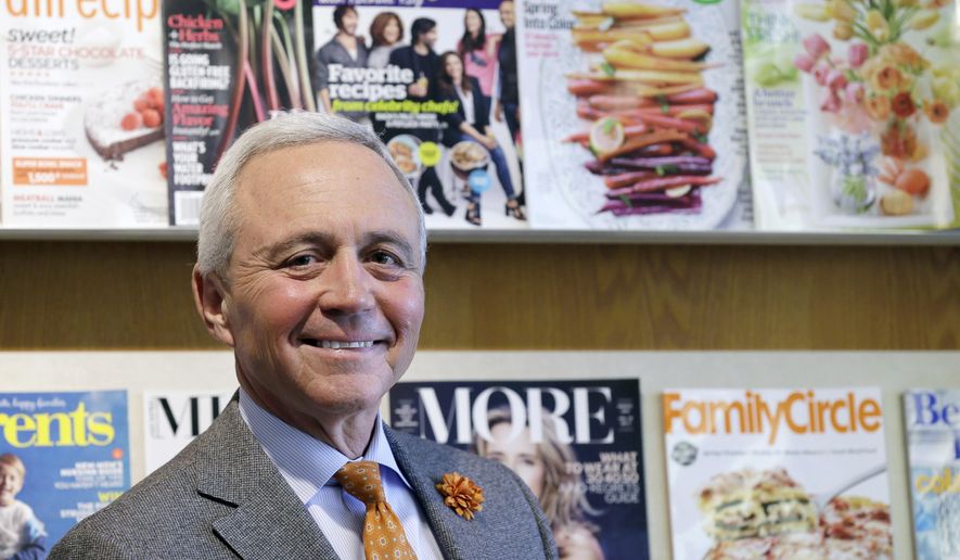 In this Feb. 25, 2015 photo, Meredith Corp. CEO Stephen Lacy stands outside his office at the company's Des Moines, Iowa, headquarters. Meredith, a company that started out as magazine with the simple goal of helping farmers find success in the early 1900s, has survived depression, recession, the internet and an increasingly crowded field of magazine competitors to become the nation’s top publisher focused on women, reaching more than 200 million people a month. (AP Photo/Charlie Neibergall)