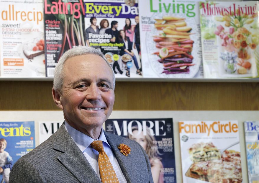 In this Feb. 25, 2015 photo, Meredith Corp. CEO Stephen Lacy stands outside his office at the company's Des Moines, Iowa, headquarters. Meredith, a company that started out as magazine with the simple goal of helping farmers find success in the early 1900s, has survived depression, recession, the internet and an increasingly crowded field of magazine competitors to become the nation’s top publisher focused on women, reaching more than 200 million people a month. (AP Photo/Charlie Neibergall)
