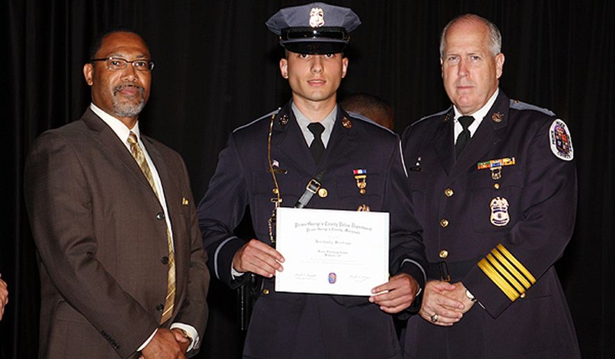 This handout photo provided by the Prince George&#39;s County, Md., Police Department, taken June 14, 2012, shows Officer Jenchesky Santiago, center, welcomed to the department by Deputy Chief Administrative Officer for Public Safety Barry Stanton, left, and Police Chief Mark Magaw at the  First Baptist Church of Glenarden Worship Center in Upper Marlboro, Md.  Santiago has been indicted on assault charges after prosecutors say he held a gun to the head of a man who hadn&#39;t committed a crime. Police and prosecutors announced Friday that a grand jury indicted Prince George&#39;s County Officer Jenchesky Santiago on charges including first-degree assault and misconduct in office. He had been suspended with pay since police began investigating the incident last June, and now is been suspended without pay. (AP Photo/Prince George&#39;s County, Md., Police Department)