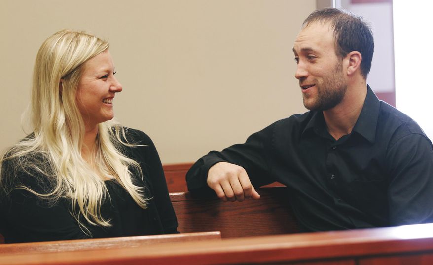 Katie Behl, left, Walworth County Treatment Court Coordinator, and Ted Hawver, who was recently accepted at UW-Whitewater, share a moment in a courtroom in Elkhorn, Wis. (AP Photo/The Janesville Gazette, Jennifer Du Puis)