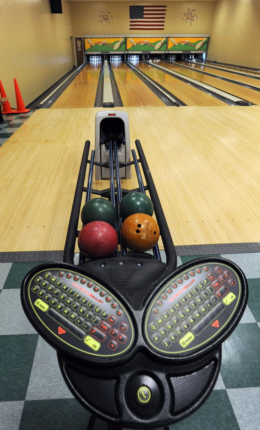 MEMBER EXCHANGE ADVANCE FOR SATURDAY, MARCH 21, 2015 - In this Friday, March 6, 2015 photo the recreation and bowling center at the Crosswinds Activity Center on Air Station Cape Cod has undergone renovations and was recently dedicated. The renovations included this new scoring system. (AP Photo/Cape Cod Times, Merrily Cassidy)