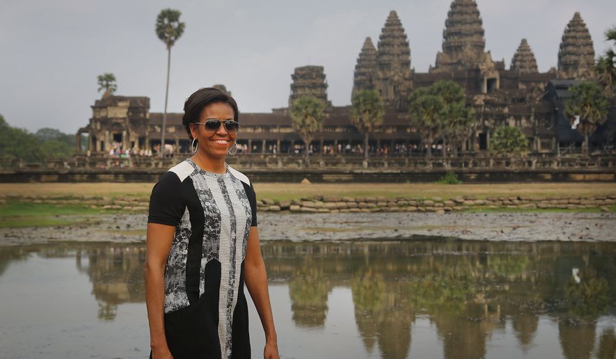 U.S. first lady Michelle Obama, takes a tour of Cambodia&#39;s famed Angkor Wat temple complex Saturday, March 21, 2015, in Siem Reap, Cambodia. Mrs. Obama on Saturday urged Cambodian students to stay in school and take advantage of their education to demand greater freedoms and more equality in their Southeast Asian country. (AP Photo/Wong Maye-E)