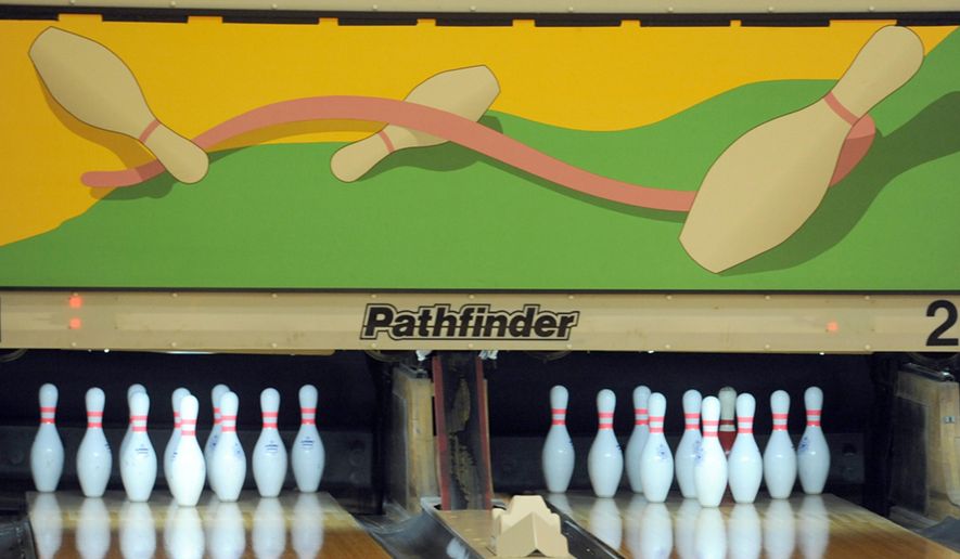 MEMBER EXCHANGE ADVANCE FOR SATURDAY, MARCH 21, 2015 - In this Friday, March 6, 2015 photo the Crosswinds Activity Center, a recreation and bowling center at Air Station Cape Cod, displays new art above the pins in Bourne, Mass. The lanes have undergone renovations and are ready for bowlers. (AP Photo/Cape Cod Times, Merrily Cassidy)