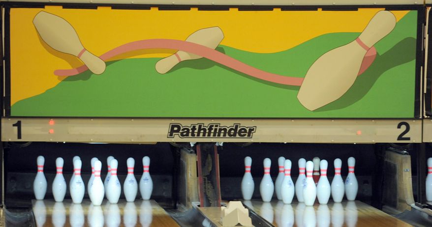 MEMBER EXCHANGE ADVANCE FOR SATURDAY, MARCH 21, 2015 - In this Friday, March 6, 2015 photo the Crosswinds Activity Center, a recreation and bowling center at Air Station Cape Cod, displays new art above the pins in Bourne, Mass. The lanes have undergone renovations and are ready for bowlers. (AP Photo/Cape Cod Times, Merrily Cassidy)