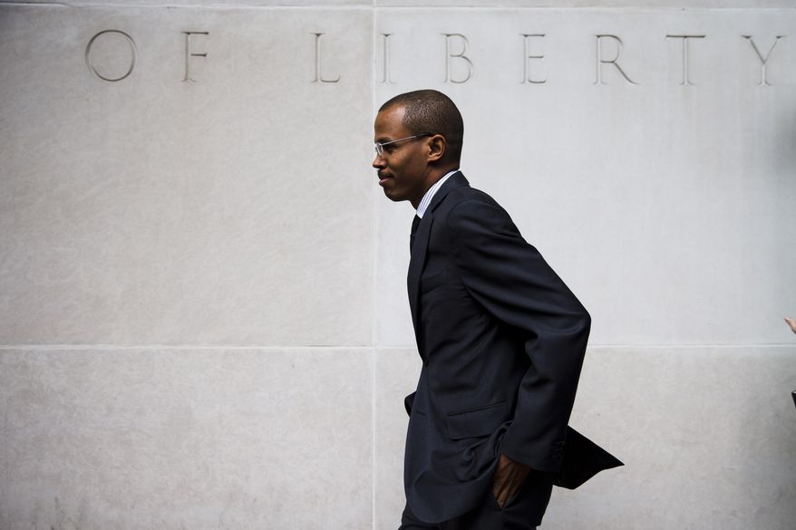 FILE - In this Aug. 14, 2014 file photo Chaka Fattah Jr., walks from the U.S. Courthouse in Philadelphia. Fattah Jr., representing himself in a sweeping federal bank fraud case, believes he is "collateral damage" in the Justice Department's long-running pursuit of his father, 10-term Democratic Rep. Chaka Fattah of Philadelphia. (AP Photo/Matt Rourke, File)