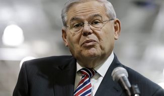 U.S. Sen. Robert Menendez, D-NJ, listens to a question while addressing a gathering Monday, March 23, 2015, in Garwood, N.J. Menendez listened to questions about the possible filing of corruption charges against him. (AP Photo/Mel Evans)
