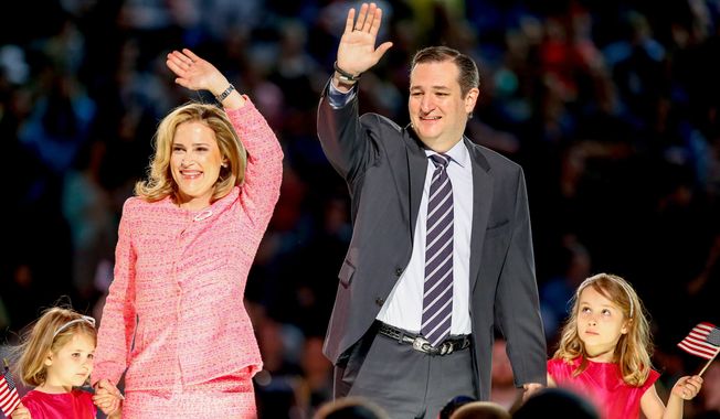 Sen. Ted Cruz, R-Texas, his wife Heidi, and their two daughters Catherine, 4, left, and Caroline, 6, right, wave on stage after he announced his campaign for president, Monday, March 23, 2015, at Liberty University, founded by the late Rev. Jerry Falwell, in Lynchburg, Va. Cruz, who announced his candidacy on twitter in the early morning hours, is the first major candidate in the 2016 race for president. (AP Photo/Andrew Harnik)