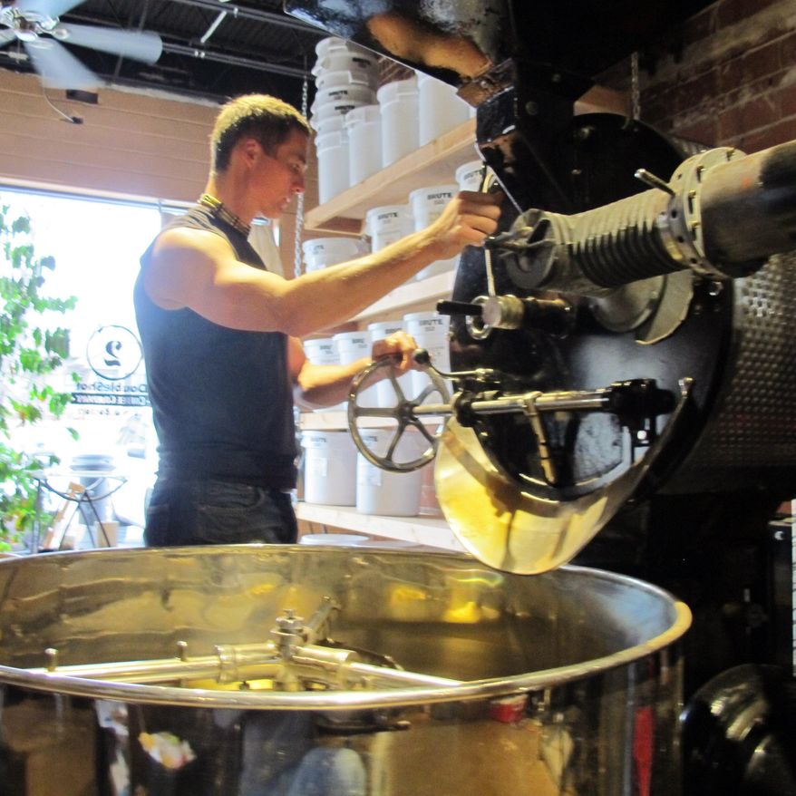 A tax proposal introduced February 2017 in the Oregon state legislature would impose an excise tax of five cents per pound on wholesale transactions of coffee beans and ground coffee. In this file photo, Brian Franklin, owner of DoubleShot Coffee Co., prepares coffee beans for roasting on Thursday, March 19, 2015 in Tulsa, Okla. (AP Photo/Justin Juozapavicius) **FILE**