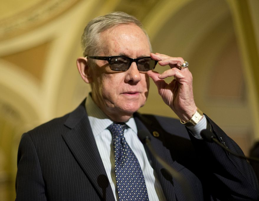 Senate Minority Leader Harry Reid of Nev. adjusts his glasses as he speaks to reporters on Capitol Hill in Washington, Tuesday, March 24, 2015, following a policy luncheon. Reid is wearing special glasses as part of his recovery from injuries suffered in an exercise accident in January. (AP Photo/Pablo Martinez Monsivais)