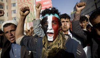 A Houthi Shiite rebel with Yemen&#x27;s flag painted on his face chants slogans during a rally to show support for the leader of rebels, Abdel-Malik al-Houthi, in Sanaa, Yemen. (Associated Press)
