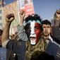 A Houthi Shiite rebel with Yemen&#39;s flag painted on his face chants slogans during a rally to show support for the leader of rebels, Abdel-Malik al-Houthi, in Sanaa, Yemen. (Associated Press)