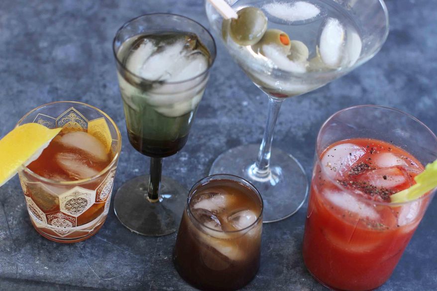 Mixed cocktails are shown, from left, an old fashioned, a vodka gimlet, a Bull Shot, a dry martini and a bloody mary. (AP Photo/Matthew Mead) ** FILE **