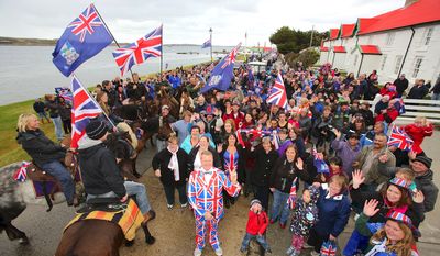 Residents gather in Stanley, Falkland Islands on March 10, 2013, during a referendum intended to show the world that they want to stay British amid increasingly bellicose claims by Argentina. AFP PHOTO / Tony Chater        (Photo credit should read TONY CHATER/AFP/Getty Images)
