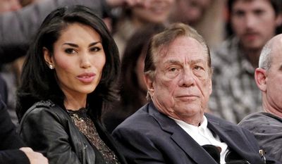 Los Angeles Clippers owner Donald Sterling, right, sits with V. Stiviano as they watch the Clippers play the Los Angeles Lakers during an NBA preseason basketball game in Los Angeles in this Dec. 19, 2011, file photo. Sterling&#39;s wife, Shelly Sterling, is going after the $2.5 million in real estate and cars her husband lavished on V. Stiviano in a trial scheduled to begin Wednesday, March 25, 2015, in Los Angeles Superior Court. (AP Photo/Danny Moloshok, File)