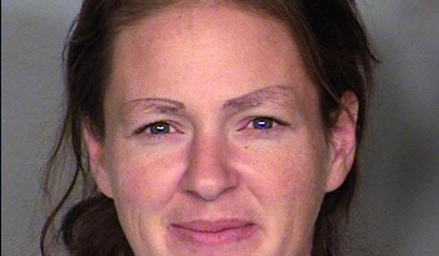 This undated booking photo provided by the Las Vegas Metropolitan Police Department shows 33-year-old Jennifer Mustachia. Police are looking for two men after arresting Mustachia who reportedly fell asleep after a deadly home invasion in Las Vegas. Authorities say Mustachia was found inside a home after an attack was reported about 2:30 a.m. Tuesday. A man was also found dead with blunt force injuries. Mustachia now faces murder, attempted murder, conspiracy, burglary and kidnapping charges. (AP Photo/Las Vegas Metropolitan Police Department)