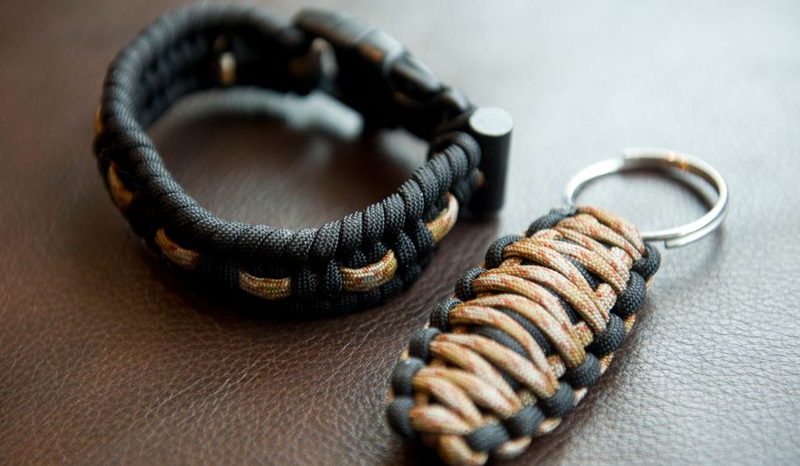 FOR RELEASE SATURDAY, MARCH 28, 2015, AT 1:32 A.M. AKDT. - This photo taken on Friday, March 6, 2015, shows two of Grayson Davey's products, the Alaska Survival Bracelet and the Firebug Keychain. (AP Photo/Alaska Dispatch News, Marc Lester) KTUU-TV OUT; KTVA-TV OUT; THE MAT-SU VALLEY FRONTIERSMAN OUT