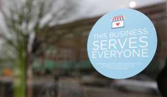 A window sticker on a downtown Indianapolis business, Wednesday, March 25, 2015, shows its objection to the Religious Freedom bill passed by the Indiana legislature. Organizers of a major gamers&#39; convention and a large church gathering say they&#39;re considering moving events from Indianapolis over a bill that critics say could legalize discrimination against gays. (AP Photo/Michael Conroy) **FILE**