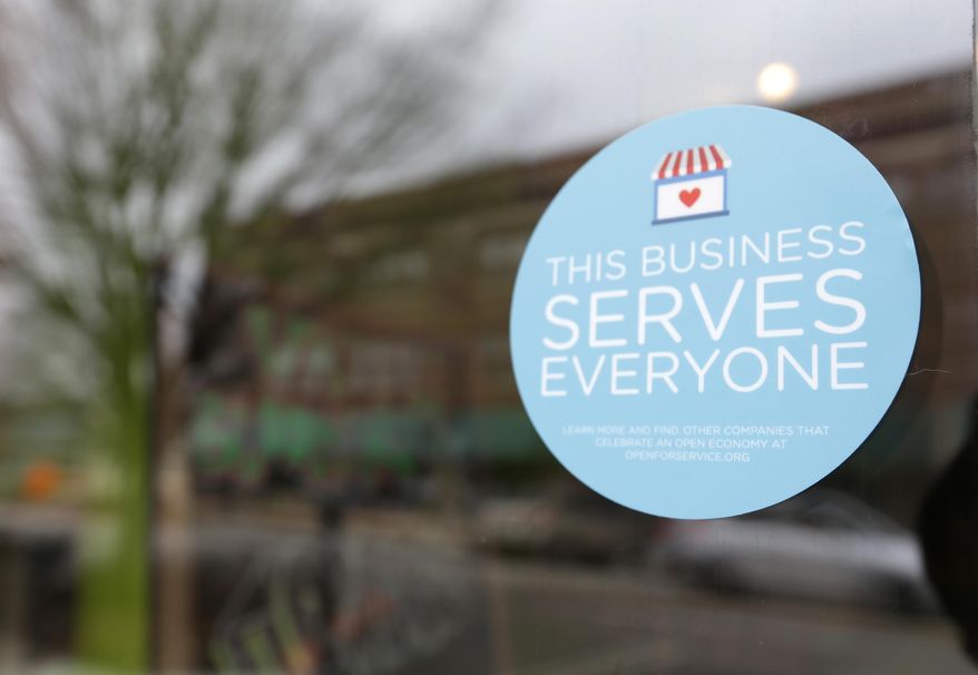 A window sticker on a downtown Indianapolis business, Wednesday, March 25, 2015, shows its objection to the Religious Freedom bill passed by the Indiana legislature. Organizers of a major gamers&#x27; convention and a large church gathering say they&#x27;re considering moving events from Indianapolis over a bill that critics say could legalize discrimination against gays. (AP Photo/Michael Conroy) **FILE**