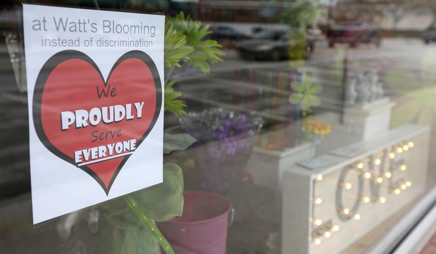 A window sign on a downtown Indianapolis florist, Wednesday, March 25, 2015, shows it&#39;s objection to the Religious Freedom bill passed by the Indiana legislature. Organizers of a major gamers&#39; convention and a large church gathering say they&#39;re considering moving events from Indianapolis over a bill that critics say could legalize discrimination against gays. (AP Photo/Michael Conroy) **FILE**