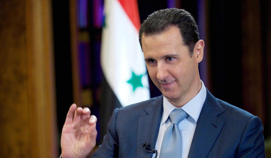 Syrian President Bashar Assad gestures during an interview with the BBC, in Damascus, Syria, in this Tuesday, Feb. 10, 2015, file photo released by the Syrian official news agency SANA. (AP Photo/SANA, File)
