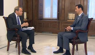 In this frame grab from video provided by CBSNews/60 Minutes, in New York, &amp;quot;60 Minutes&amp;quot; contributor Charlie Rose, left, interviews Syrian President Bashar Assad, Thursday, March 26, 2015, in Damascus, Syria. Assad says he would be open to a dialogue with the United States, but that it must be &amp;quot;based on mutual respect,&amp;quot; during the interview scheduled to be broadcast Sunday, March 29. (AP Photo/CBSNews/60 Minutes)