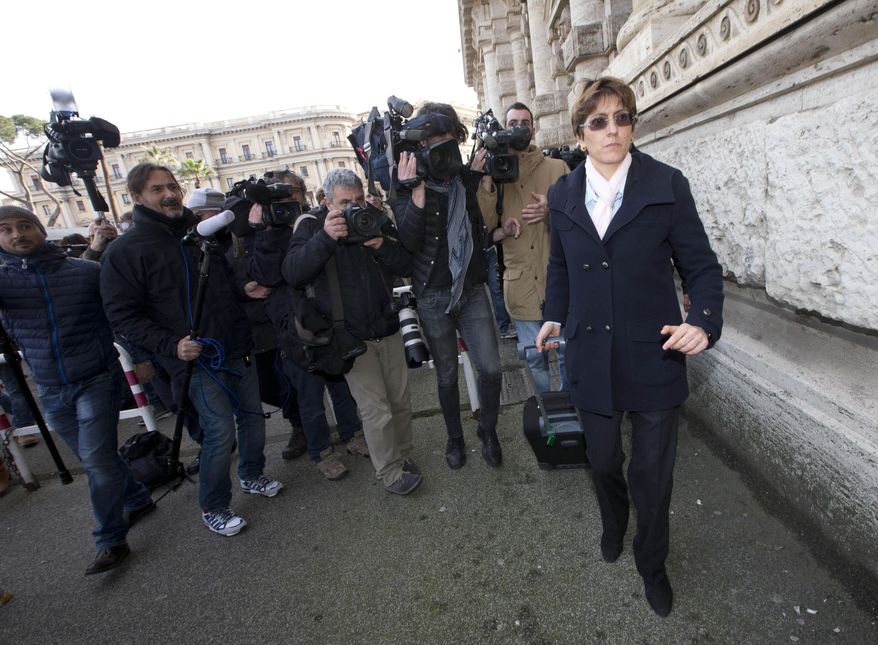 Raffaele Sollecito's lawyer Giulia Bongiorno, right, arrives at Italy's highest court building, in Rome, Friday, March 27, 2015. American Amanda Knox and her Italian ex-boyfriend expect to learn their fate Friday when Italy's highest court hears their appeal of their guilty verdicts in the brutal 2007 murder of Knox's British roommate. Several outcomes are possible, including confirmation of the verdicts, a new appeals round, or even a ruling that amounts to an acquittal in the sensational case that has captivated audiences on both sides of the Atlantic. (AP Photo/Alessandra Tarantino )