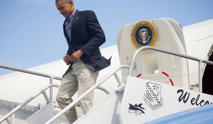 President Barack Obama walks down the stairs upon his arrival on Air Force One at St. Lucie International Airport, Saturday, March 28, 2015, in Fort Pierce, Fla. Obama kicked off the spring season on Saturday with a weekend getaway in Florida, golfing with buddies the upscale resort where he once caused a stir by hitting the links with Tiger Woods. (AP Photo/Pablo Martinez Monsivais)