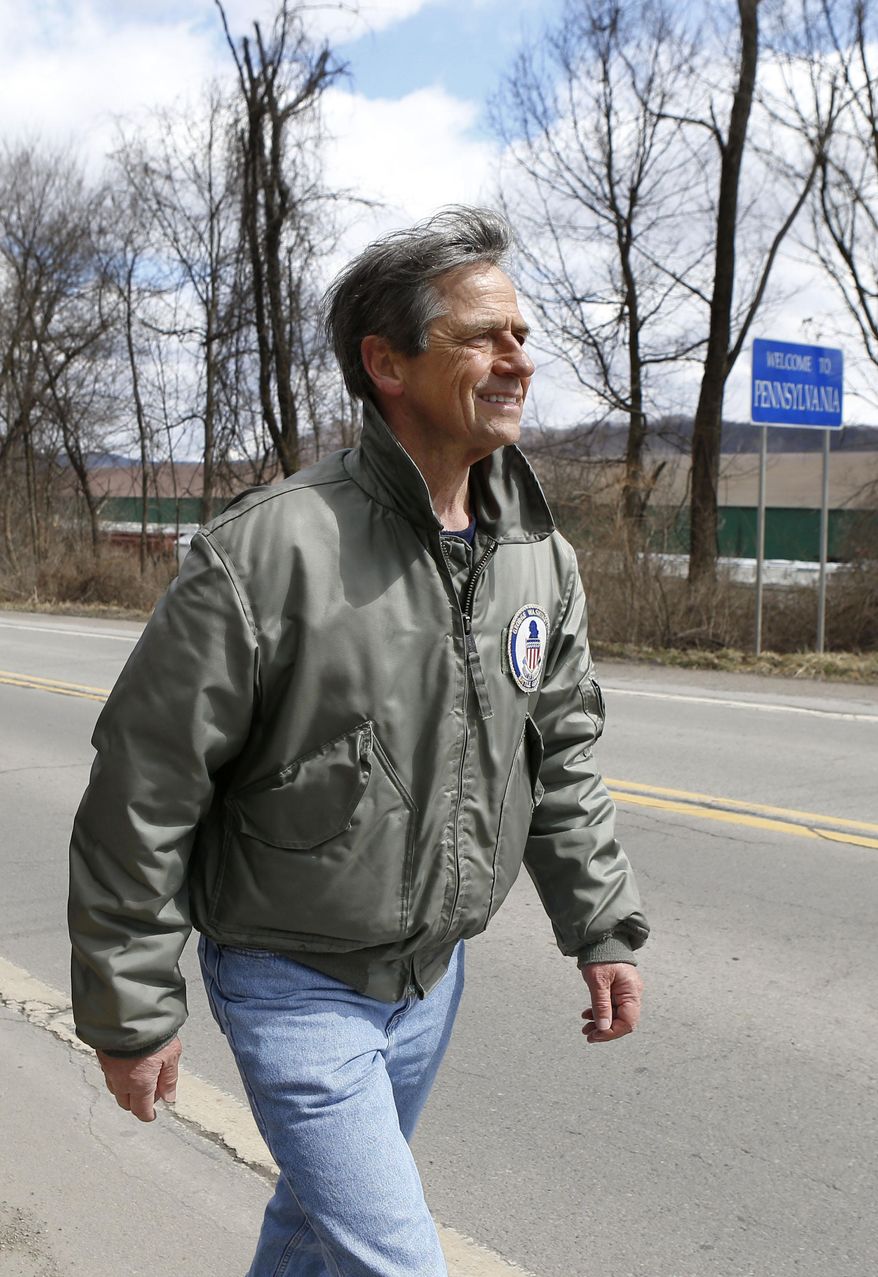 Joe Sestak, a candidate seeking the Democratic Party nomination for the US Senate, passes a sign for the border between Pennsylvania and Ohio as he completes his &amp;quot;Walking In Other Pennsylvanian&#x27;s Shoes&amp;quot;, walking tour across the state of Pennsylvania on Saturday, March 28, 2015, in Ohioville, Pa. (AP Photo/Keith Srakocic)