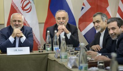 working late: Members of the Iranian delegation (from left) Foreign Minister Javad Zarif, atomic energy director Ali Akbar Salehi, presidential aide Hossein Fereydoun and Deputy Foreign Minister Abbas Araghchi are meeting with delegates from Britain, Russia, China, France, Germany, the European Union and the U.S. (Associated Press)