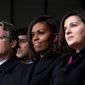 First lady Michelle Obama (center), flanked by Connecticut State Sen. Ted Kennedy Jr. (left) and Victoria Reggie Kennedy, attends the dedication of the Edward M. Kennedy Institute for the United States Senate in Boston Monday, named for the late senator. The $79 million project&#39;s unveiling was attended by President Obama, Vice President Joseph R. Biden and senators of both parties, many of whom had friendly feuds with Kennedy. (associated press)