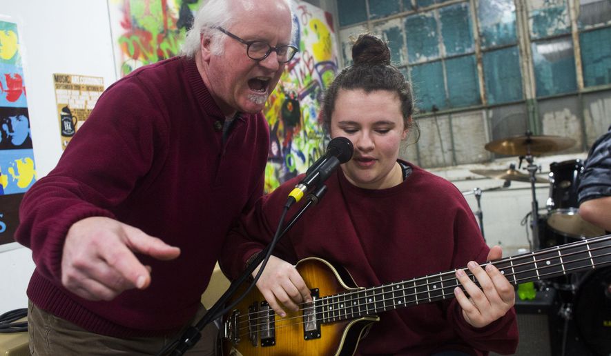 Jeff Mitchell leads a band during one of their practice sessions at the Kalamazoo Academy of Rock in Kalamazoo, Mich. on Wednesday March 4, 2015. Mitchell teaches rock music to students ages 8-18 throughout the week at the Academy at the former Gibson Guitar Co. factory in Kalamazoo. (AP Photo/Kalamazoo Gazette-MLive Media Group, Christian Randolph) ALL LOCAL TELEVISION OUT; LOCAL TELEVISION INTERNET OUT