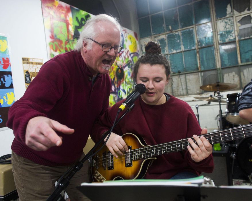 Jeff Mitchell leads a band during one of their practice sessions at the Kalamazoo Academy of Rock in Kalamazoo, Mich. on Wednesday March 4, 2015. Mitchell teaches rock music to students ages 8-18 throughout the week at the Academy at the former Gibson Guitar Co. factory in Kalamazoo. (AP Photo/Kalamazoo Gazette-MLive Media Group, Christian Randolph) ALL LOCAL TELEVISION OUT; LOCAL TELEVISION INTERNET OUT