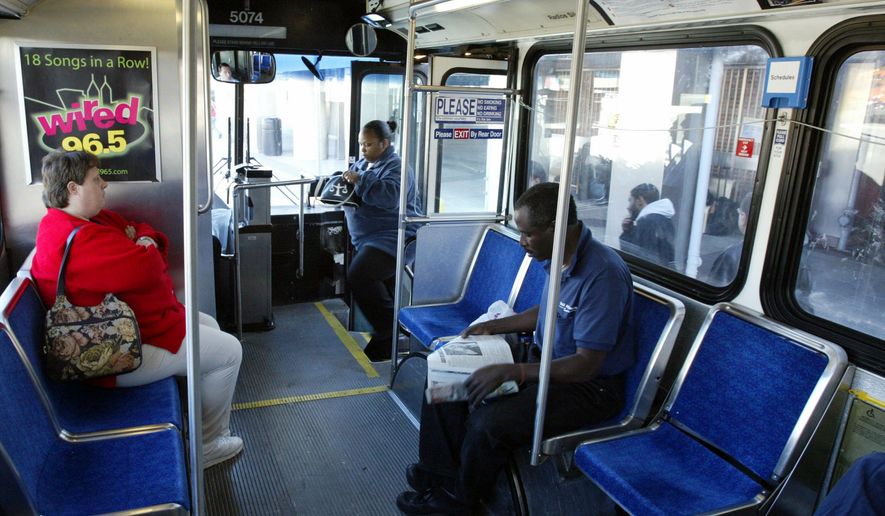 Commuters board a Southeastern Pennsylvania Transportation Authorty (SEPTA) bus at the Frankford Transportation Center in Philadelphia on Nov. 7, 2005. (Associated Press) **FILE**