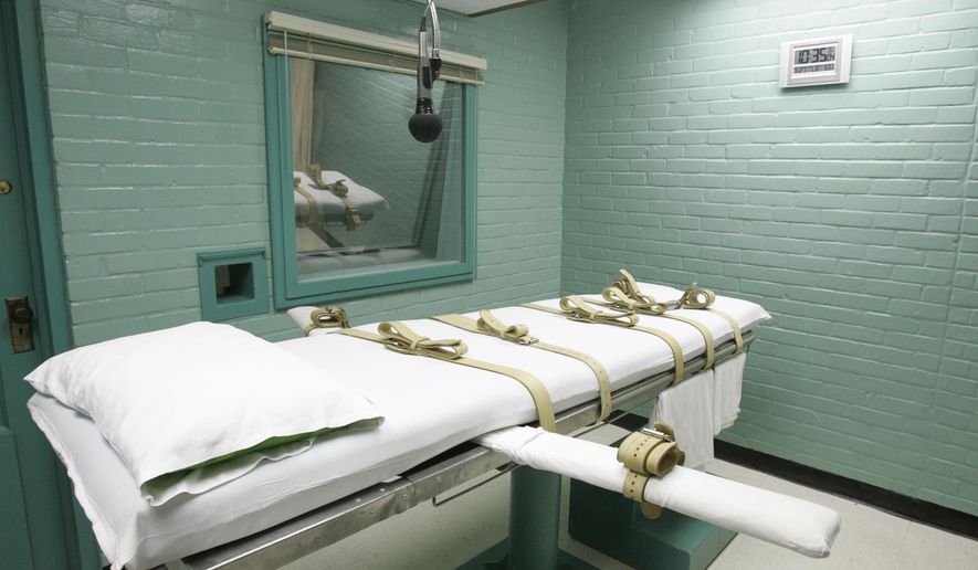 FILE - This May 27, 2008 file photo shows the State of Texas execution chamber in Huntsville, Texas. A leading association for pharmacists on Monday has approved a proposal declaring that participation in lethal injection executions by compounding pharmacies would be a violation of core pharmacy values. (AP Photo/Pat Sullivan, File)
