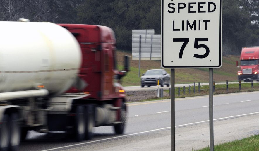 In this Thursday, March 12, 2015 photo, trucks travel along I-45 near Huntsville, Texas. Many tractor-trailers on the nation’s roads are driven faster than the 75 mph their tires are designed to handle, a practice that has been linked to wrecks and blowouts but has largely escaped the attention of highway officials. (AP Photo/Pat Sullivan)