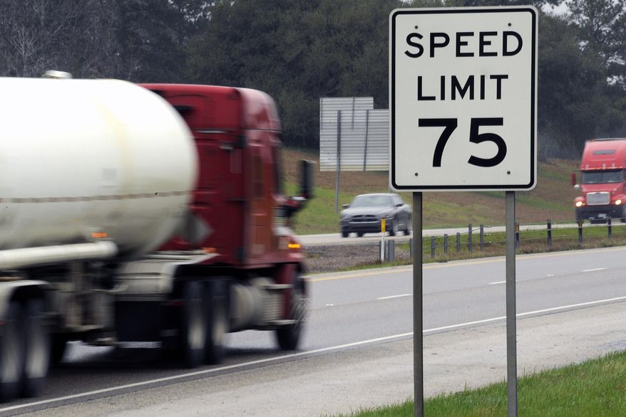 In this Thursday, March 12, 2015 photo, trucks travel along I-45 near Huntsville, Texas. Many tractor-trailers on the nation’s roads are driven faster than the 75 mph their tires are designed to handle, a practice that has been linked to wrecks and blowouts but has largely escaped the attention of highway officials. (AP Photo/Pat Sullivan)