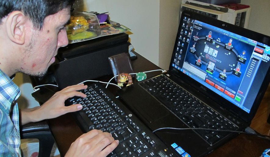This Nov. 26, 2013 file photo shows Jon Hernandez of Roselle Park N.J. playing a game of Internet poker from his home on the first full day Internet gambling was legal in New Jersey. On Tuesday March 31, 2015, Morgan Stanley cut its estimate of the U.S. Internet gambling market nearly in half, predicting $2.7 billion in revenue by 2020, down from a $5 billion initial estimate. (AP Photo/Wayne Parry, FILE)